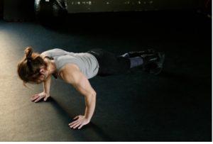 A woman doing full body push up